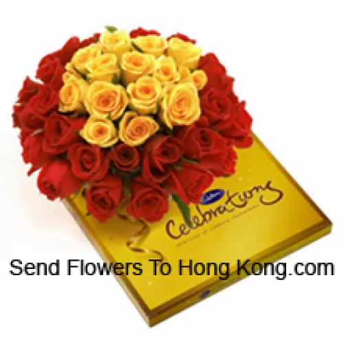 Bouquet de 24 roses rouges et 12 roses jaunes avec des garnitures saisonnières accompagné d'une belle boîte de chocolats Cadbury