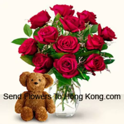 12 Red Roses With Some Ferns In A Glass Vase Along With A Cute 12 Inches Tall Brown Teddy Bear